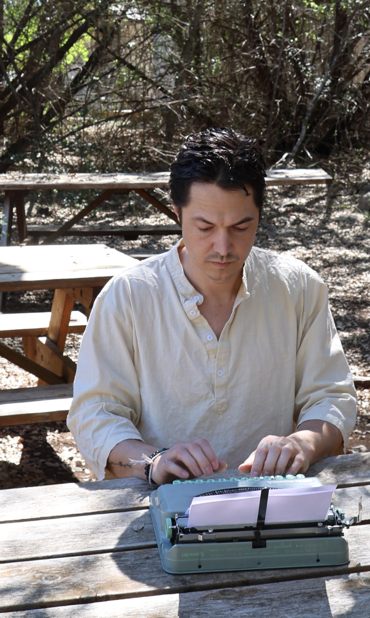 Stephen writing on a vintage typewriter
