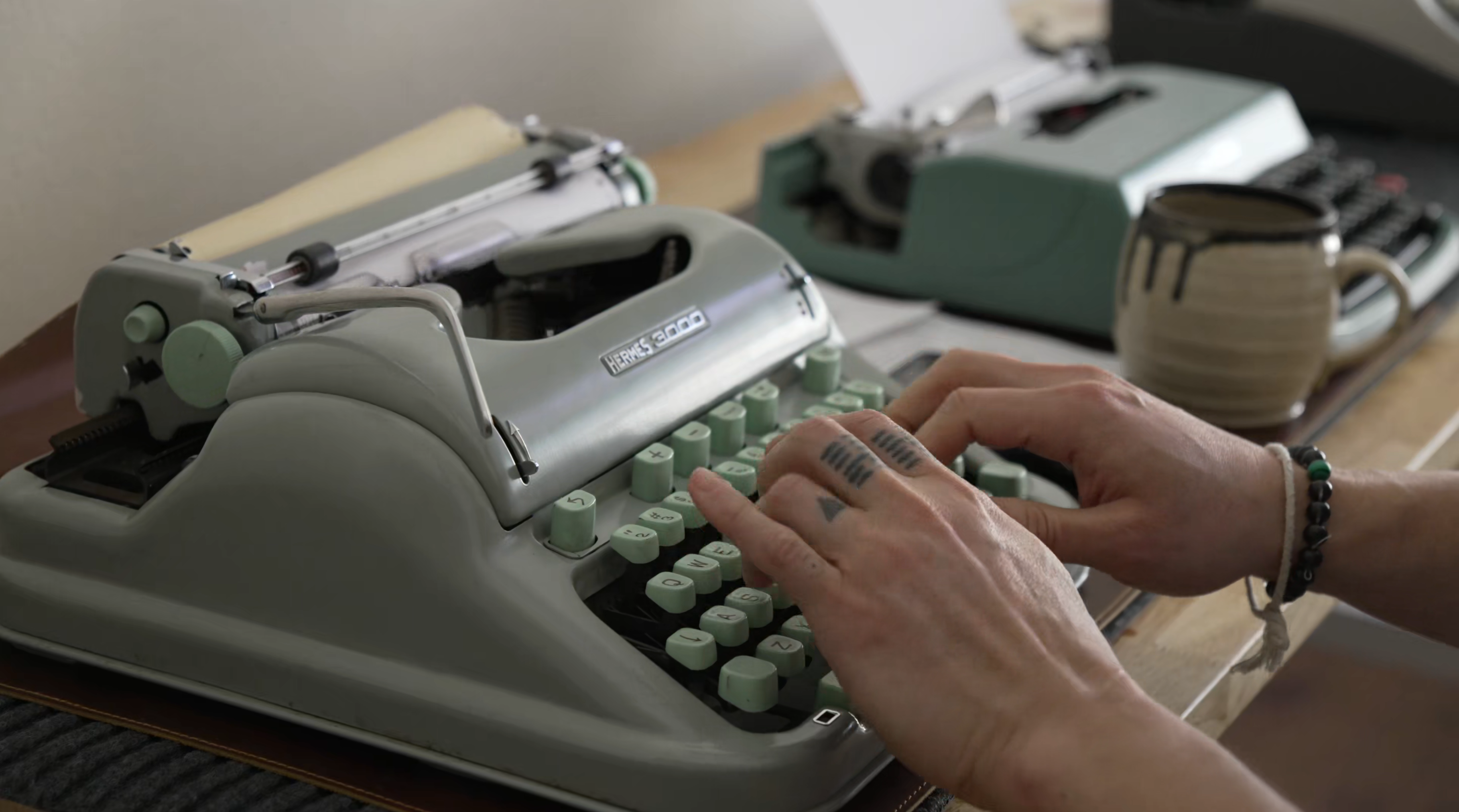 Hands typing on the typewriter