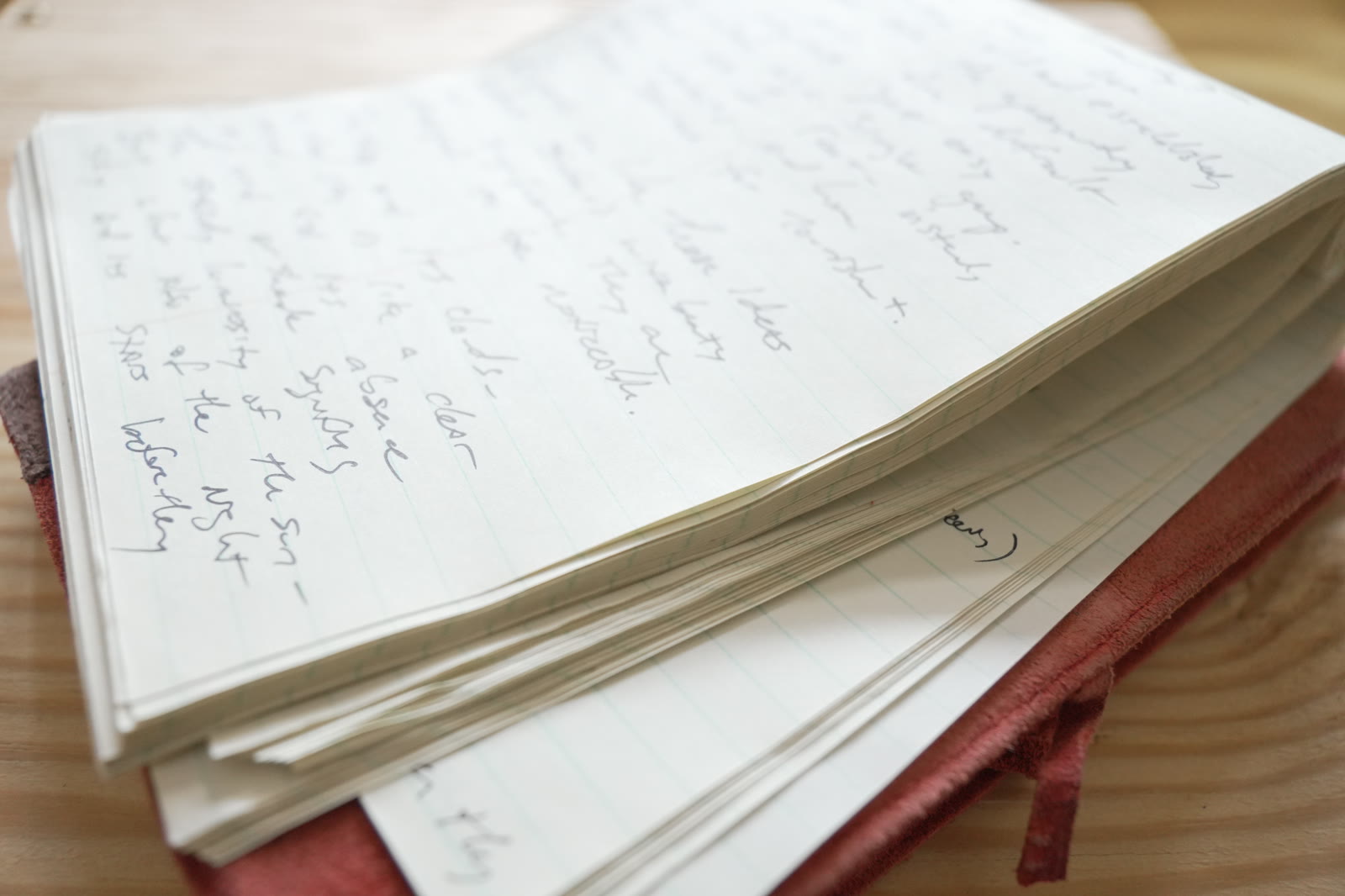 Close-up of handwritten pages showing the shift from scattered to settled writing